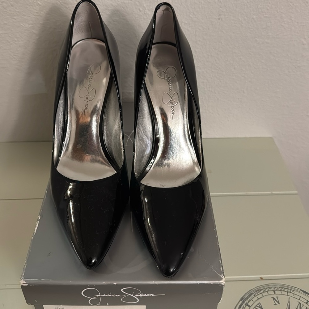 Patent black pumps by Jessica Simpson size 9.5. Unique gorgeous heel!